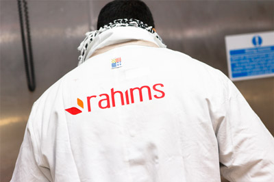 rahims careers, man standing with rahims logo on back